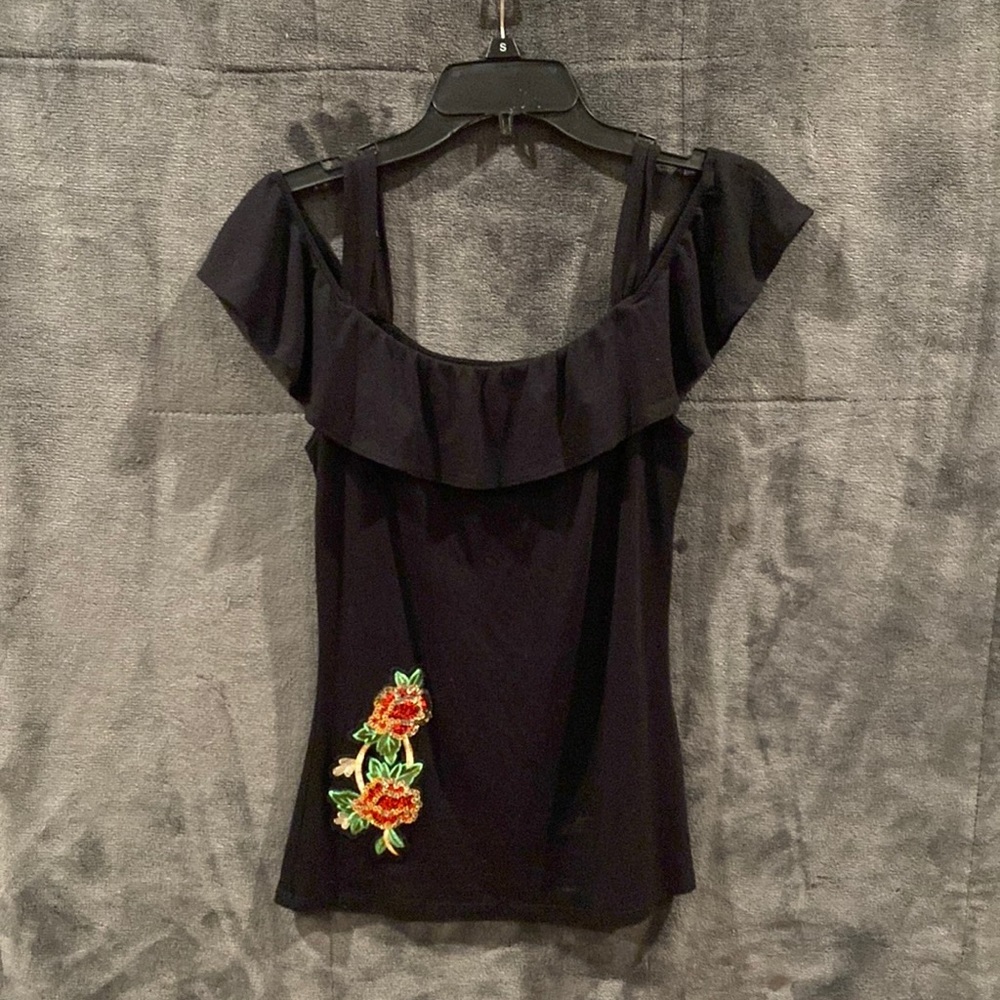 Small off the shoulder black top with sequin rose.
